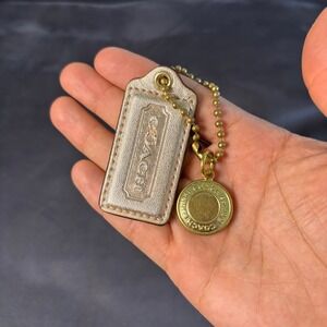Coach Metallic Champagne Gold Leather Hangtag and 1941 Logo Medallion Charm Set